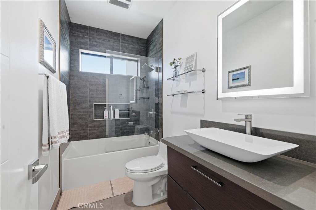 5487 Blanco Way Culver City, CA 90230 - Photo 43 of 58 a bathroom with a sink a toilet and shower