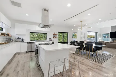 a kitchen that has a sink and a stove