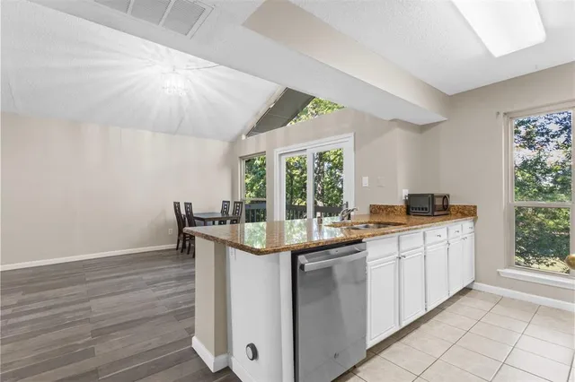 a kitchen with a sink and cabinets