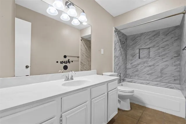 a bathroom with a sink a toilet and a bathtub