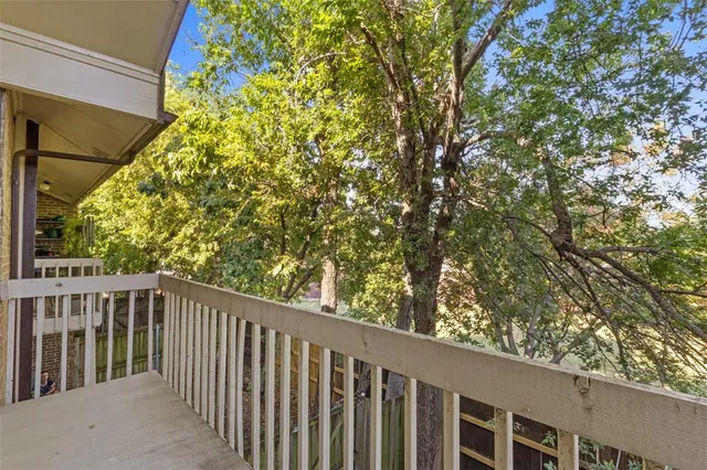 a balcony with trees