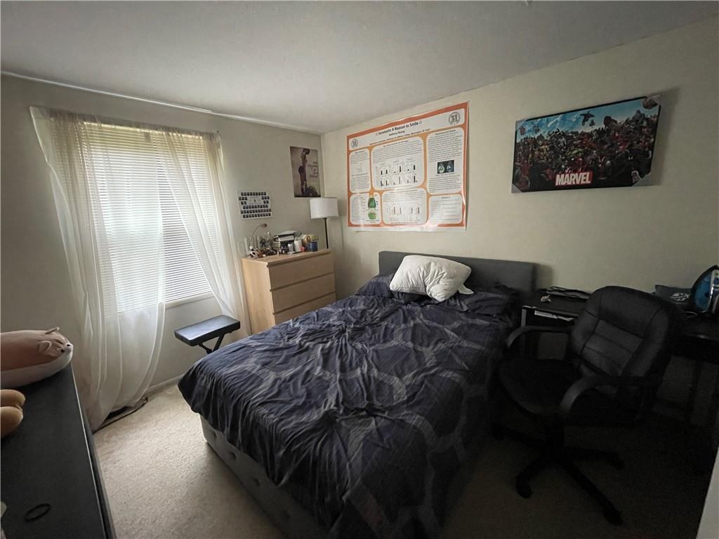 271 Quail Run Road Venetia, PA 15367 - Photo 19 of 30 a bedroom with a bed and wooden floor