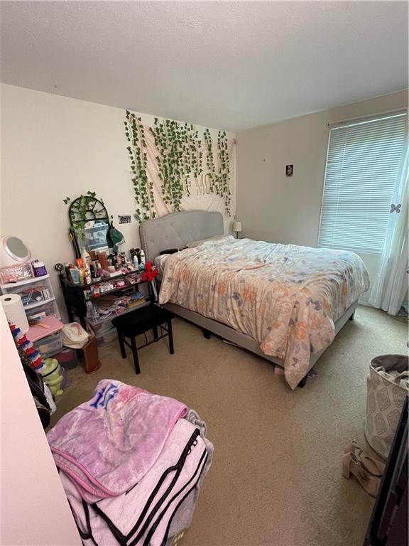 271 Quail Run Road Venetia, PA 15367 - Photo 21 of 30 a bedroom with bed and a table