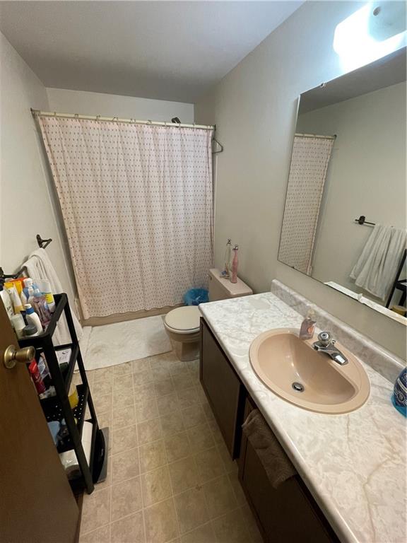 271 Quail Run Road Venetia, PA 15367 - Photo 23 of 30 a bathroom with a sink and a mirror