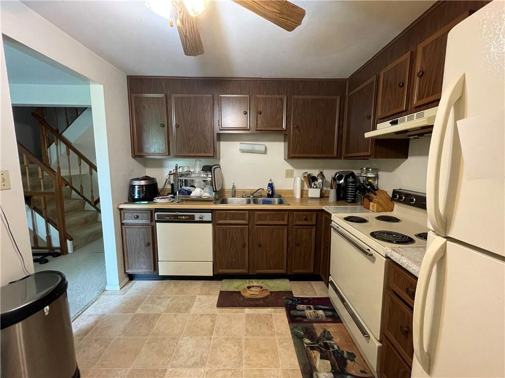 271 Quail Run Road Venetia, PA 15367 - Photo 9 of 30 a kitchen with a sink stove and cabinets