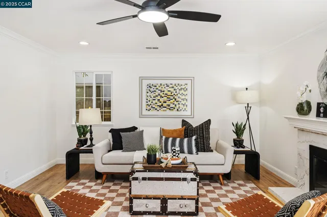 a living room with furniture and a fireplace