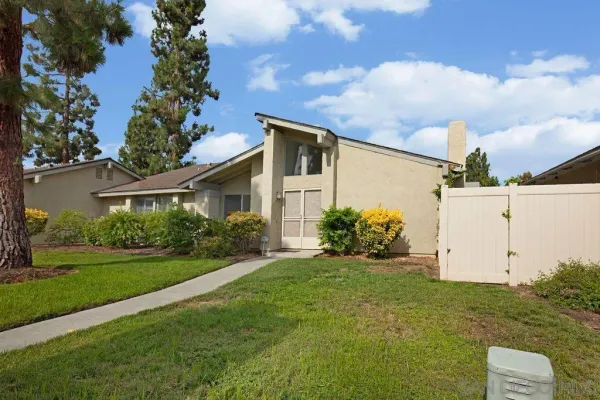 a view of a back yard of the house