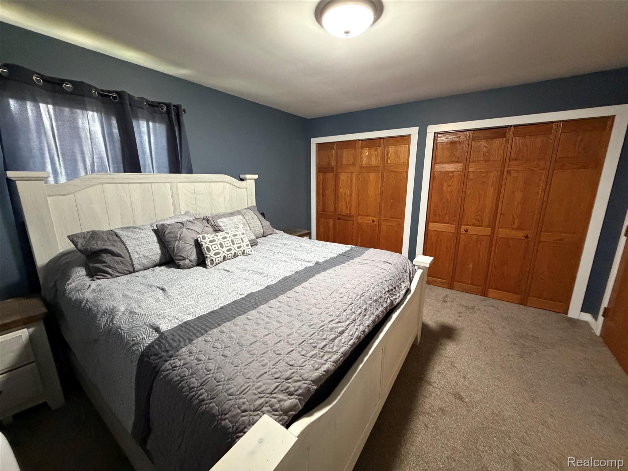 2712 North Branch Road North Branch, MI 48461 - Photo 22 of 37 Carpeted bedroom with multiple closets