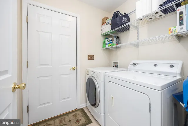a view of a house with backyard and deck
