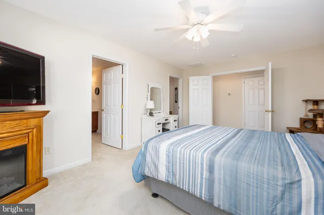 a view of house with yard and sitting area