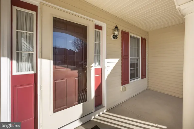 a kitchen with stainless steel appliances granite countertop a stove top oven a sink dishwasher and cabinets with wooden floor