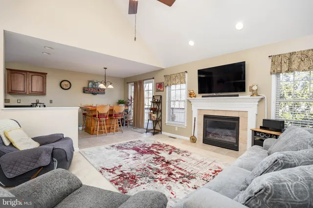 a spacious bathroom with a double vanity sink a mirror and a toilet