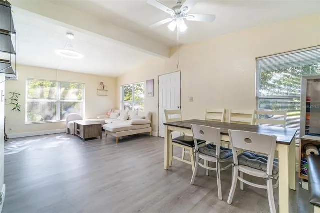a view of a dining room with furniture window and outside view