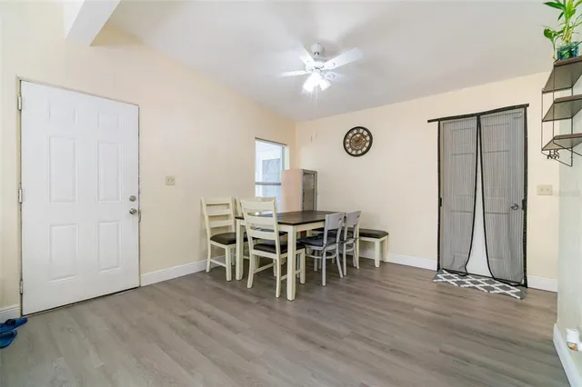 a view of a dining room with furniture and chandelier
