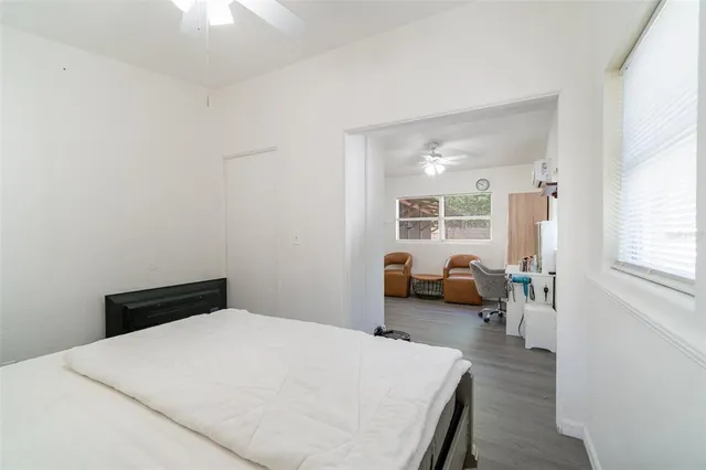 a bedroom with a bed and a couch