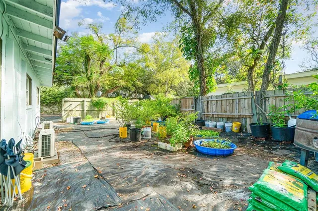 a view of a backyard with sitting area and furniture