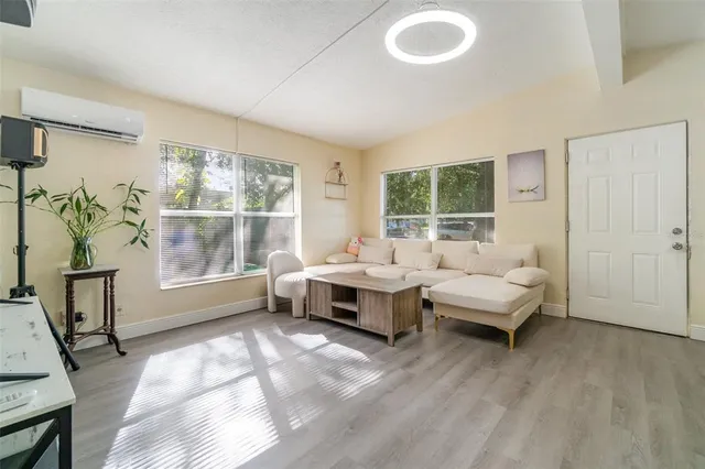 a living room with furniture and a large window