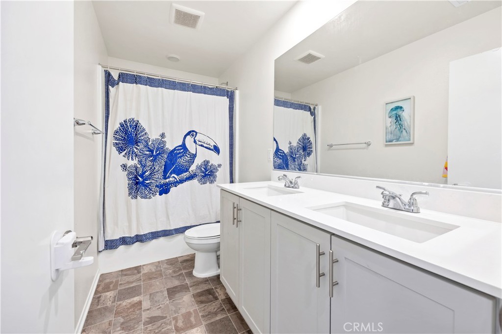 34758 Criollo Way Fallbrook, CA 92028 - Photo 14 of 25 a bathroom with a sink and a mirror