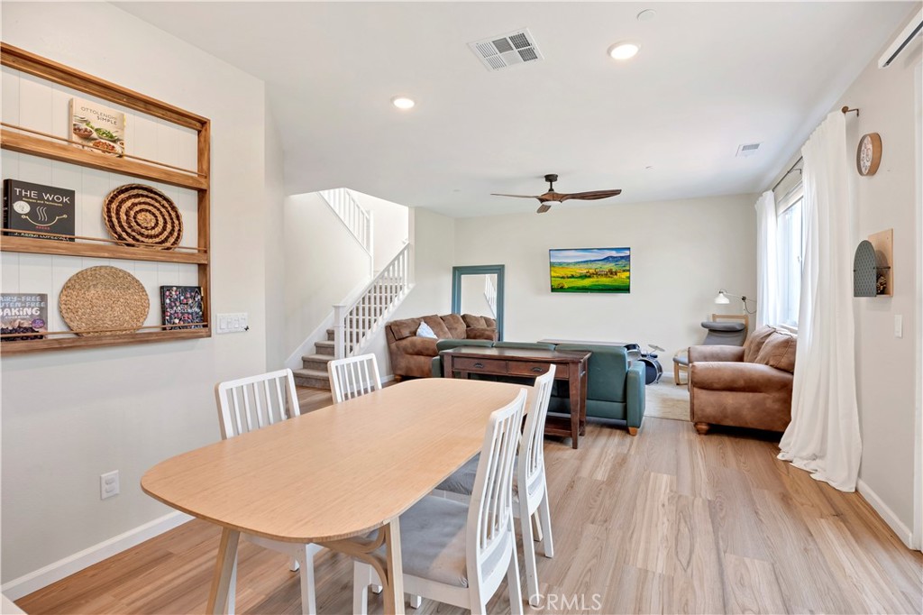 34758 Criollo Way Fallbrook, CA 92028 - Photo 5 of 25 a living room with furniture and a wooden floor