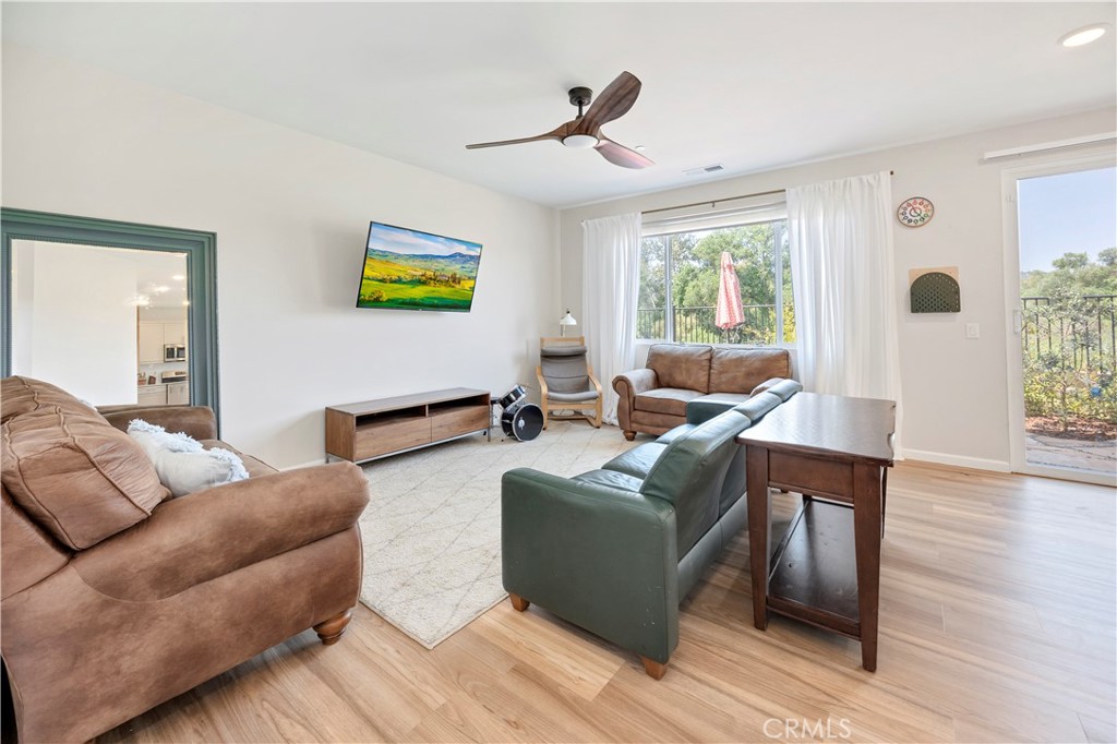 34758 Criollo Way Fallbrook, CA 92028 - Photo 7 of 25 a living room with furniture and a wooden floor