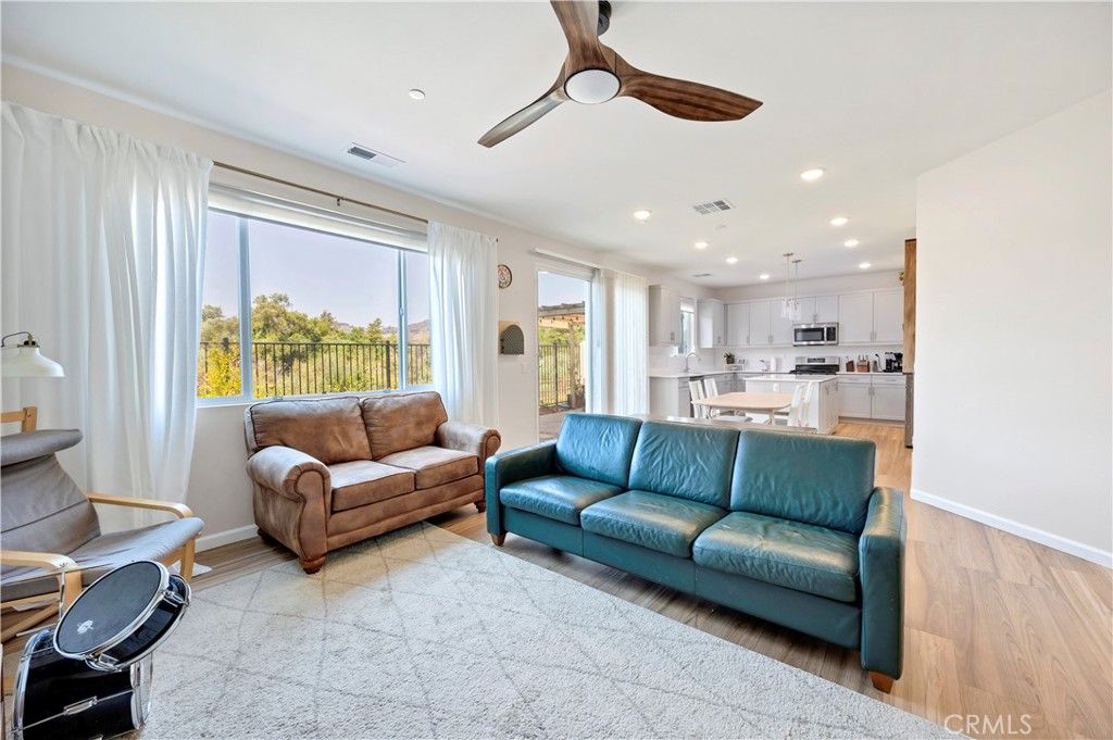 34758 Criollo Way Fallbrook, CA 92028 - Photo 8 of 25 a living room with furniture and a large window