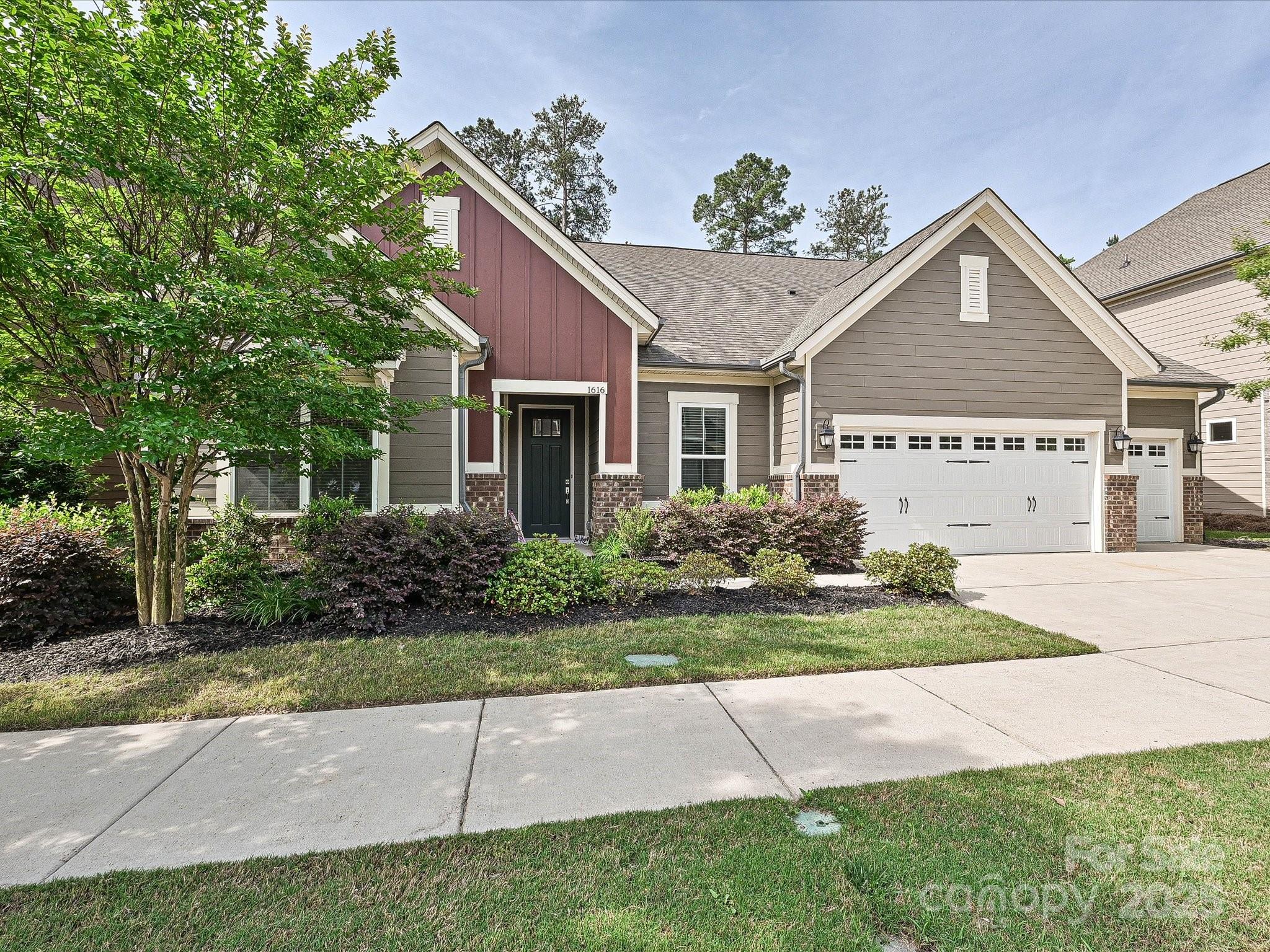 1616 Afton Way Fort Mill, SC 29708 - Photo 1 of 38 a front view of a house with a yard and potted plants