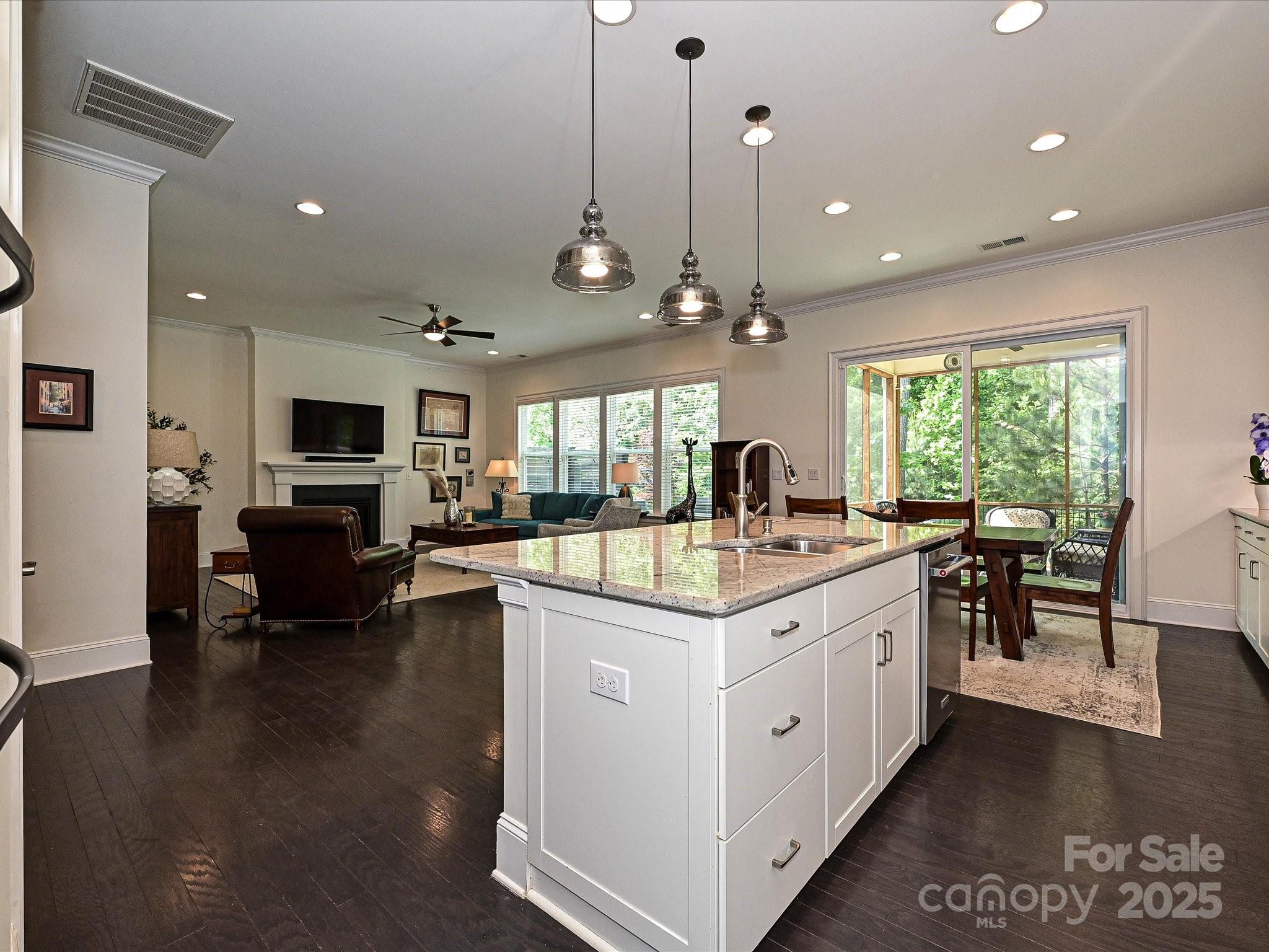 1616 Afton Way Fort Mill, SC 29708 - Photo 11 of 38 a kitchen with kitchen island granite countertop a sink counter top space and stainless steel appliances