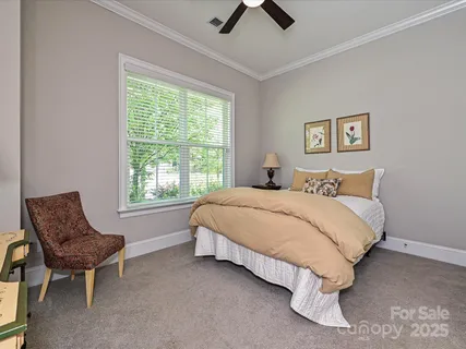 a bedroom with a bed and chair