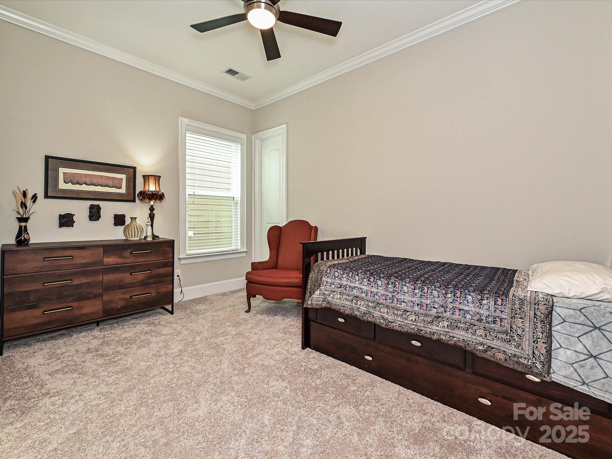 1616 Afton Way Fort Mill, SC 29708 - Photo 25 of 38 a spacious bedroom with a bed and a chandelier