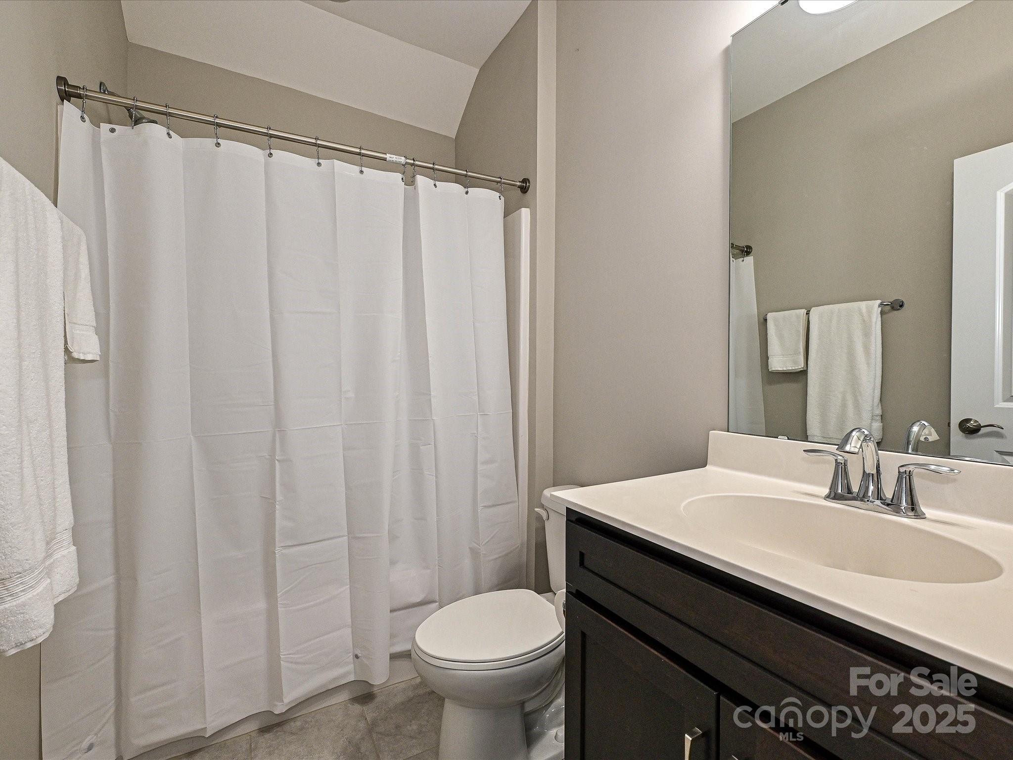 1616 Afton Way Fort Mill, SC 29708 - Photo 30 of 38 a bathroom with a sink and a mirror