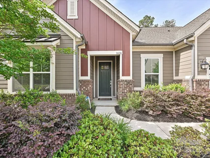 front view of a house with potted plants