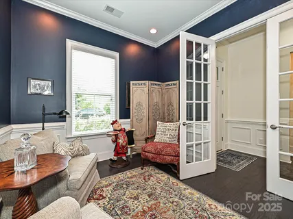 a bedroom with furniture and a window