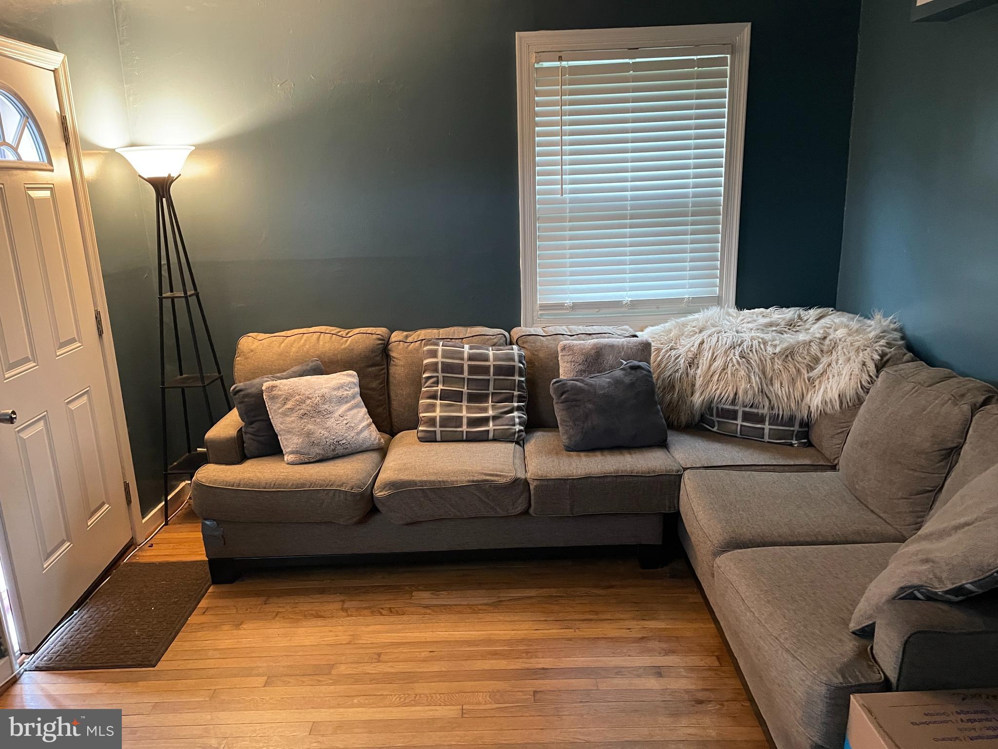 2307 Wyngate Road Suitland, MD 20746 - Photo 2 of 22 a living room with furniture and a window
