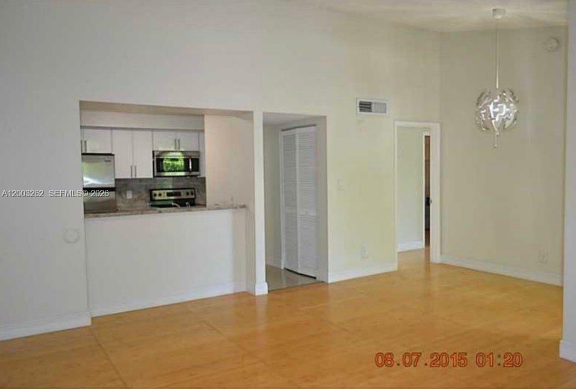 620 South Park Road, Unit 312 Hollywood, FL 33021 - Photo 7 of 14 a view of a room with cabinet and a flat screen tv
