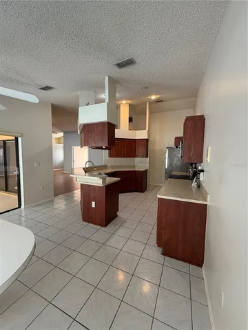 a kitchen with stainless steel appliances a sink and cabinets