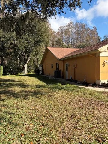 a house with trees in the background