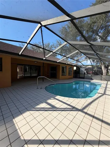 a view of a swimming pool with a patio