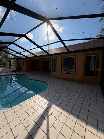 a view of a backyard of the house