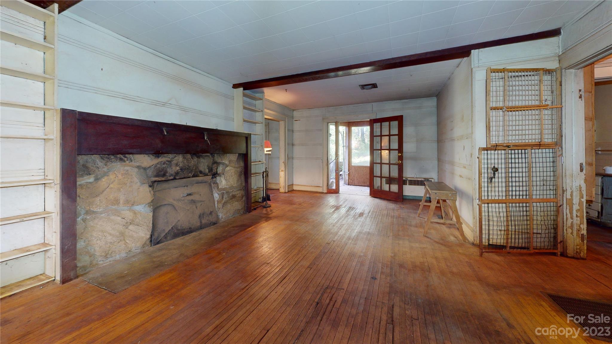 324 Buzzard's Roost Road Cullowhee, NC 28723 - Photo 11 of 18 a view of a hallway with wooden floor and windows