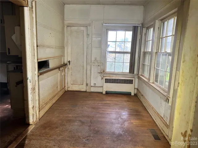a view of hallway with stairs and furniture
