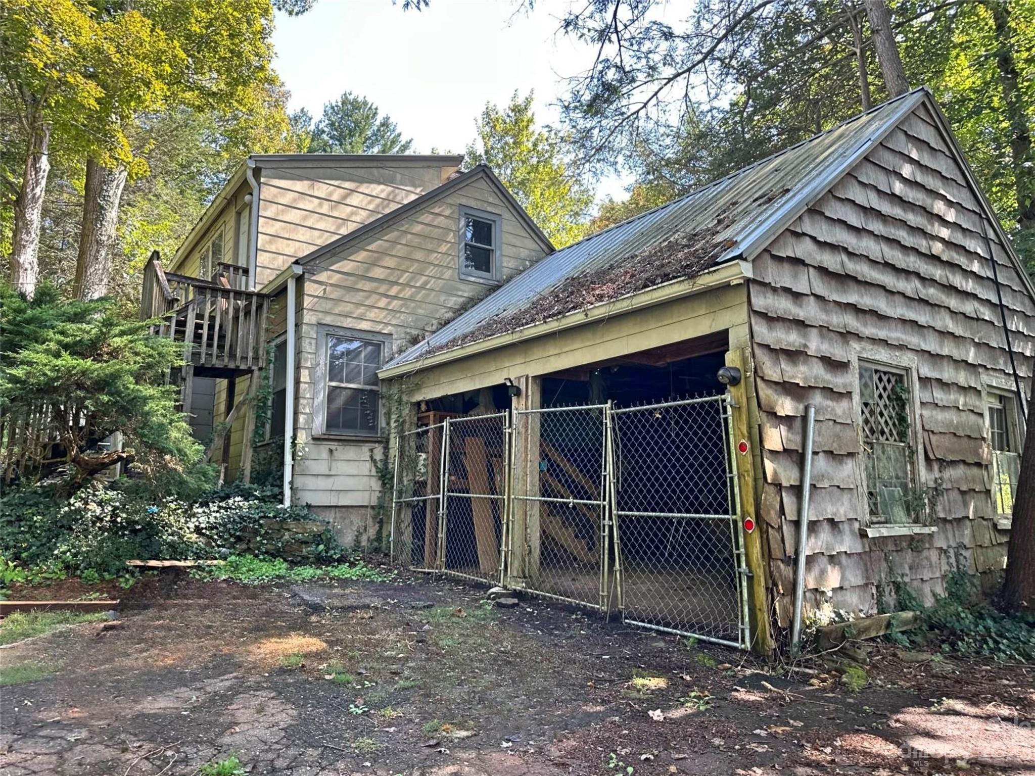 324 Buzzard's Roost Road Cullowhee, NC 28723 - Photo 4 of 18 a front view of a house with a yard