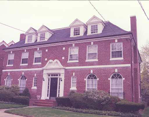 62 Manet Road, Unit 1 62 Newton, MA 02467 - Photo 1 of 1 a front view of a building with a couple of cars parked in front of house