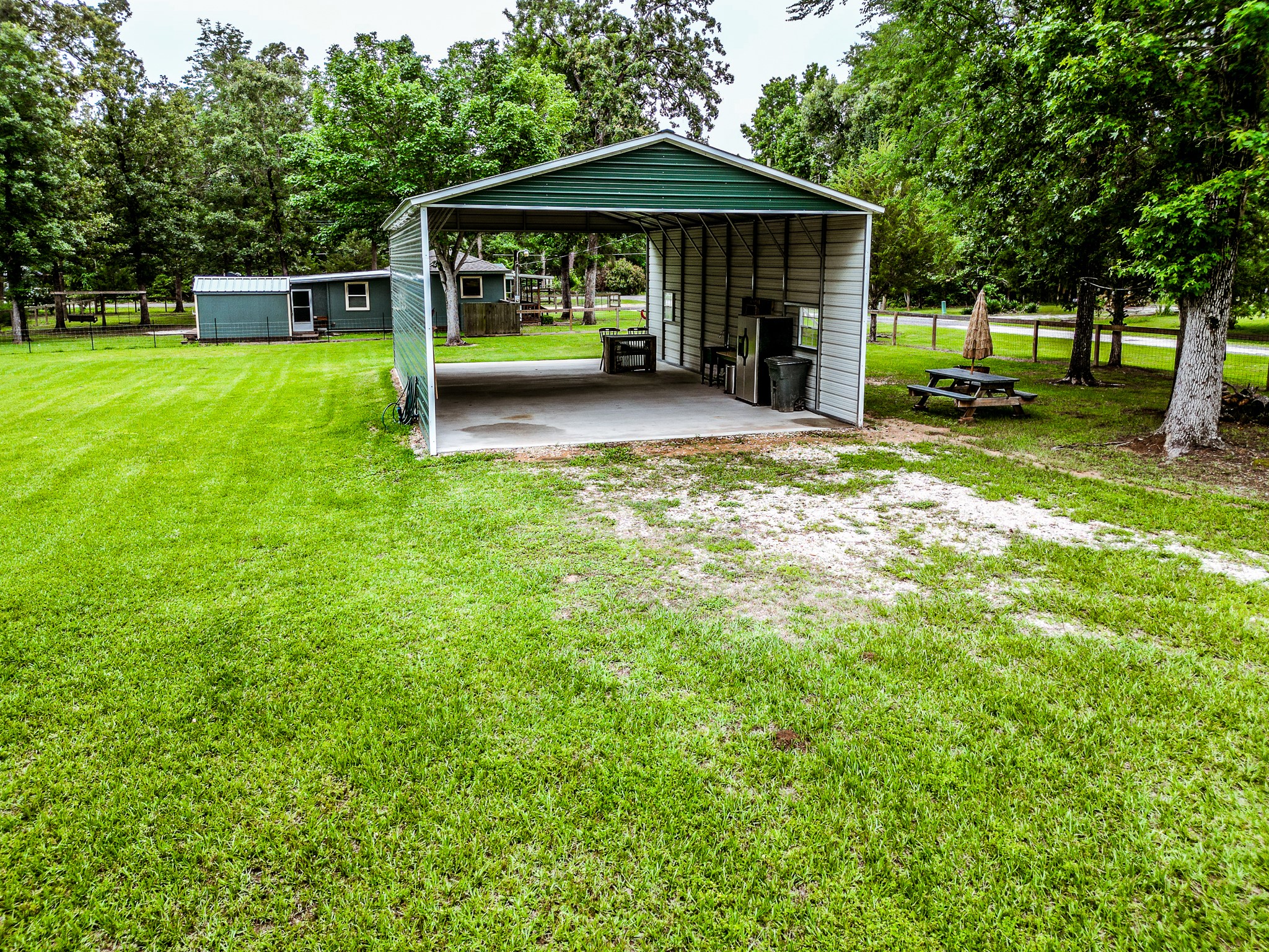 140 6th Street Trinity, TX 75862 - Photo 4 of 13 a view of a house with a yard