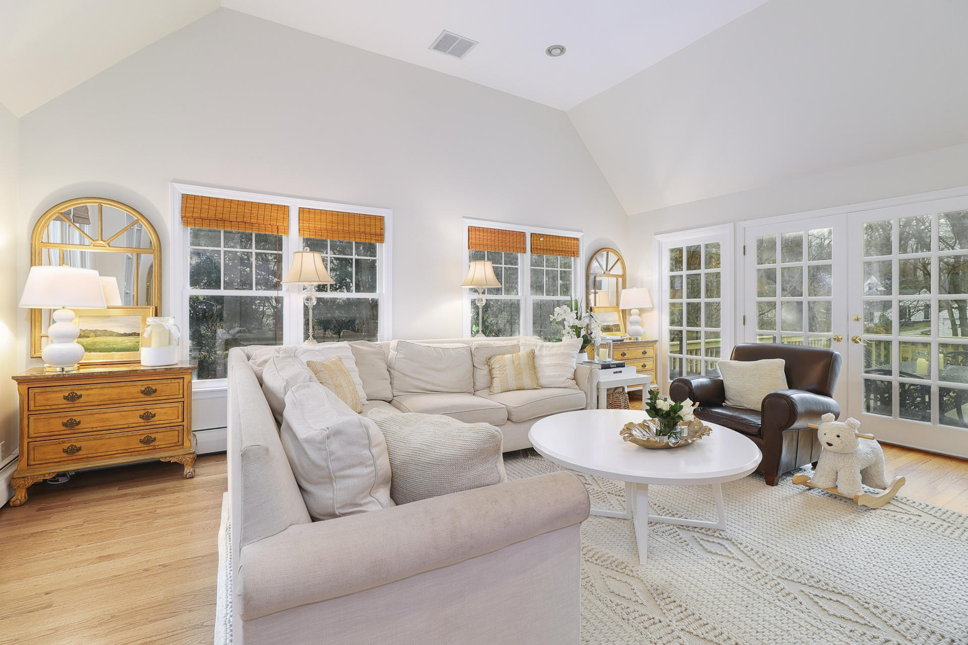 22 Birch Road Darien, CT 06820 - Photo 14 of 40 a living room with furniture and three windows