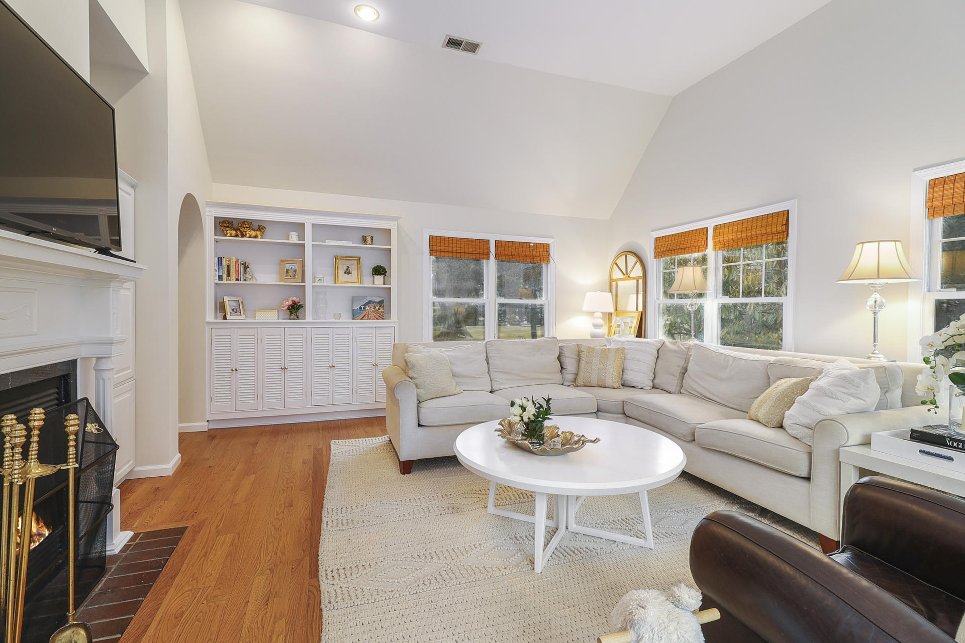 22 Birch Road Darien, CT 06820 - Photo 15 of 40 a living room with furniture fireplace and a flat screen tv