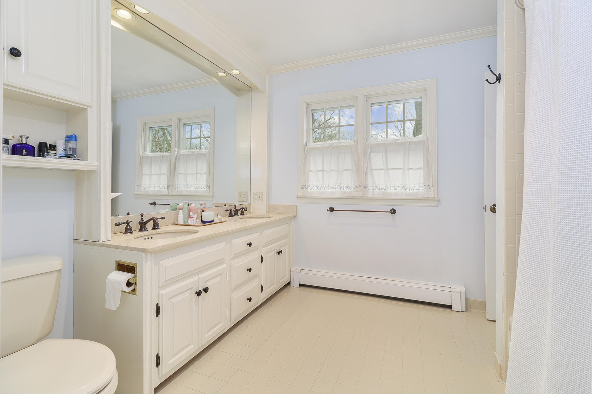 22 Birch Road Darien, CT 06820 - Photo 23 of 40 a bathroom with a sink a toilet and a window