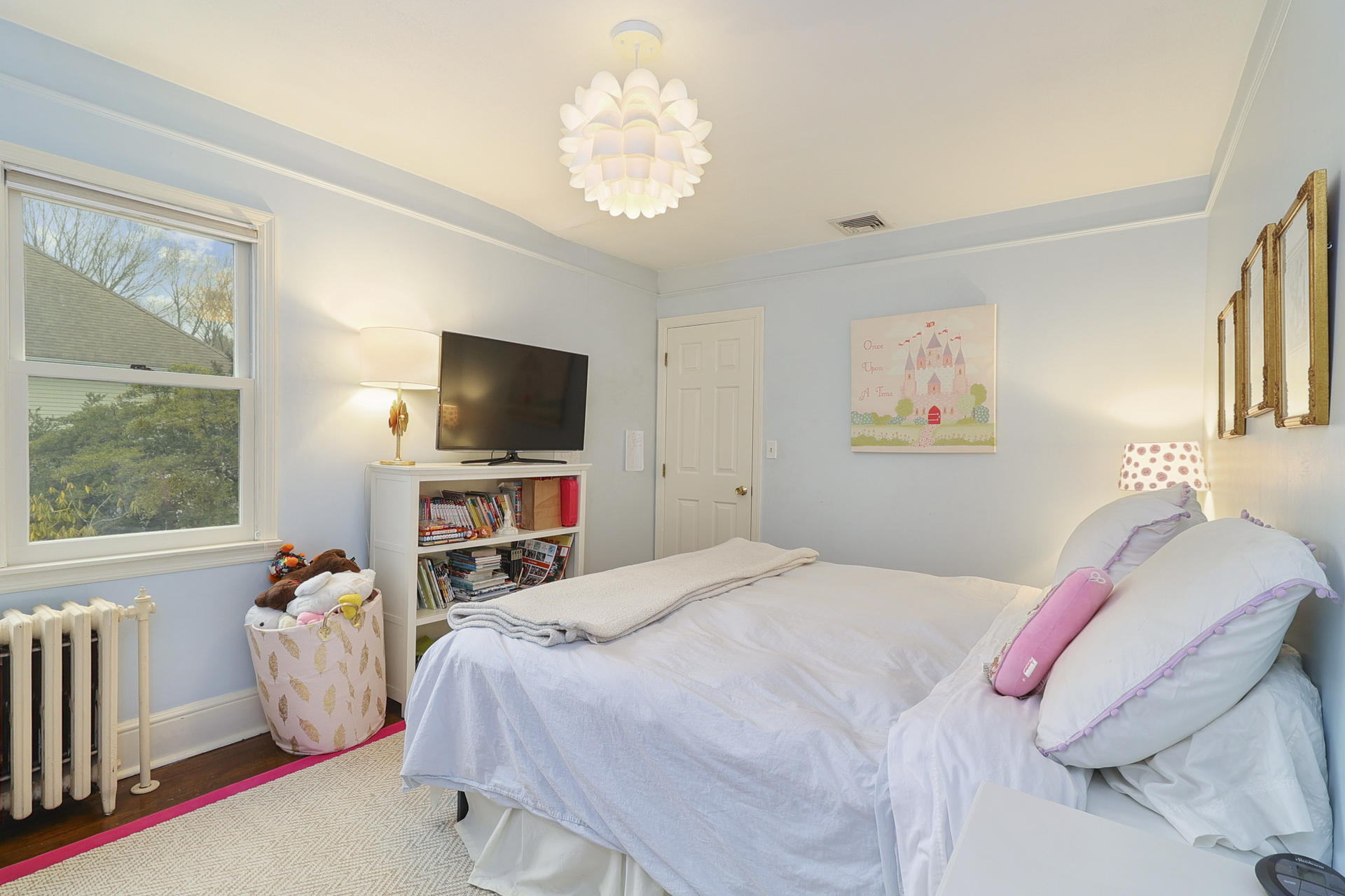 22 Birch Road Darien, CT 06820 - Photo 24 of 40 a bedroom with bed and a flat tv screen on the dresser