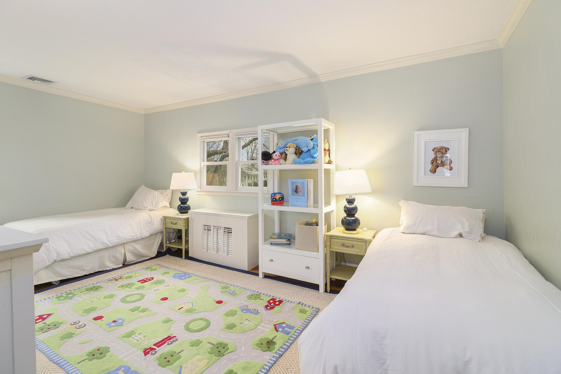 22 Birch Road Darien, CT 06820 - Photo 25 of 40 a bed room with a bed and a baby bed