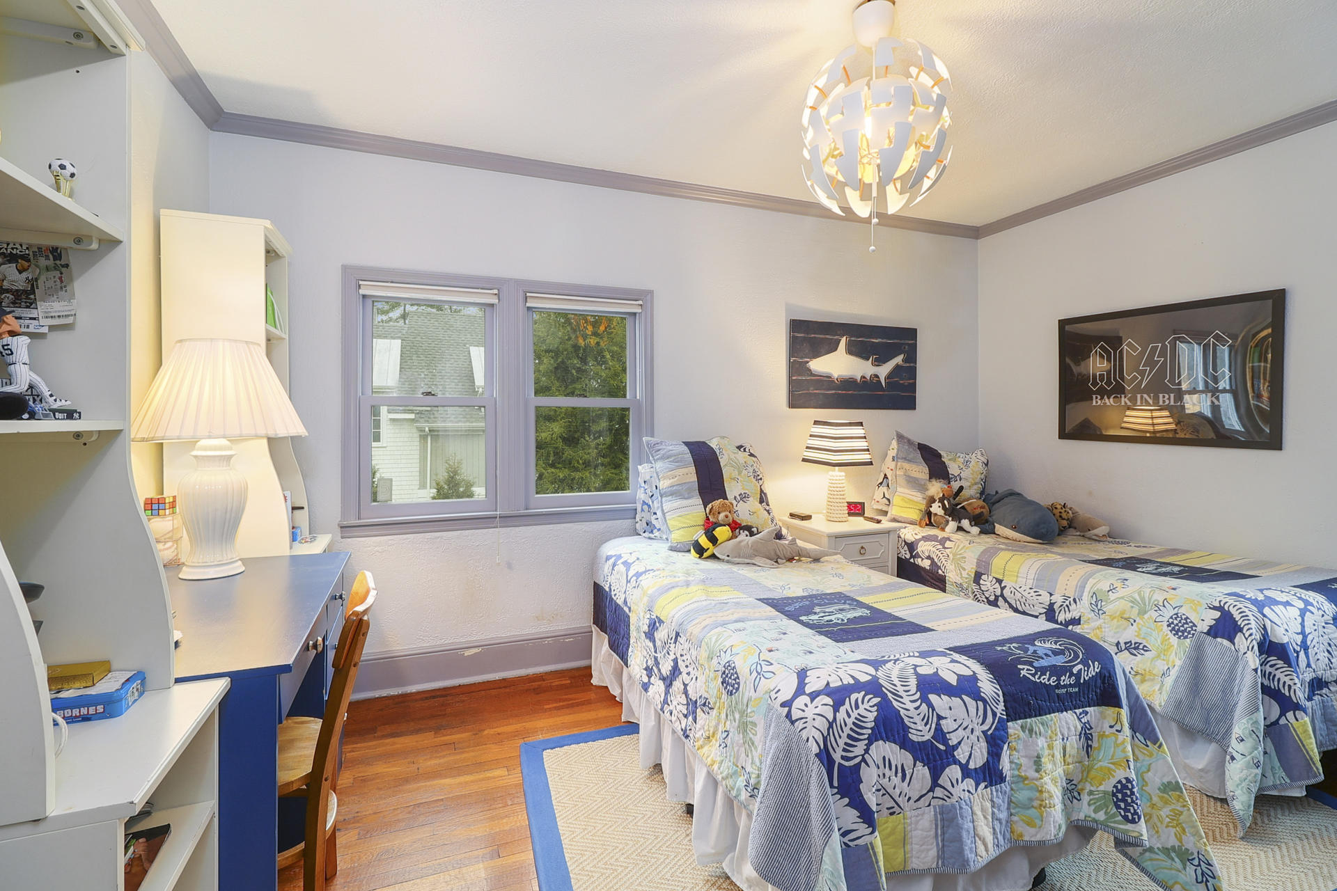 22 Birch Road Darien, CT 06820 - Photo 27 of 40 a bedroom with a bed and a chandelier