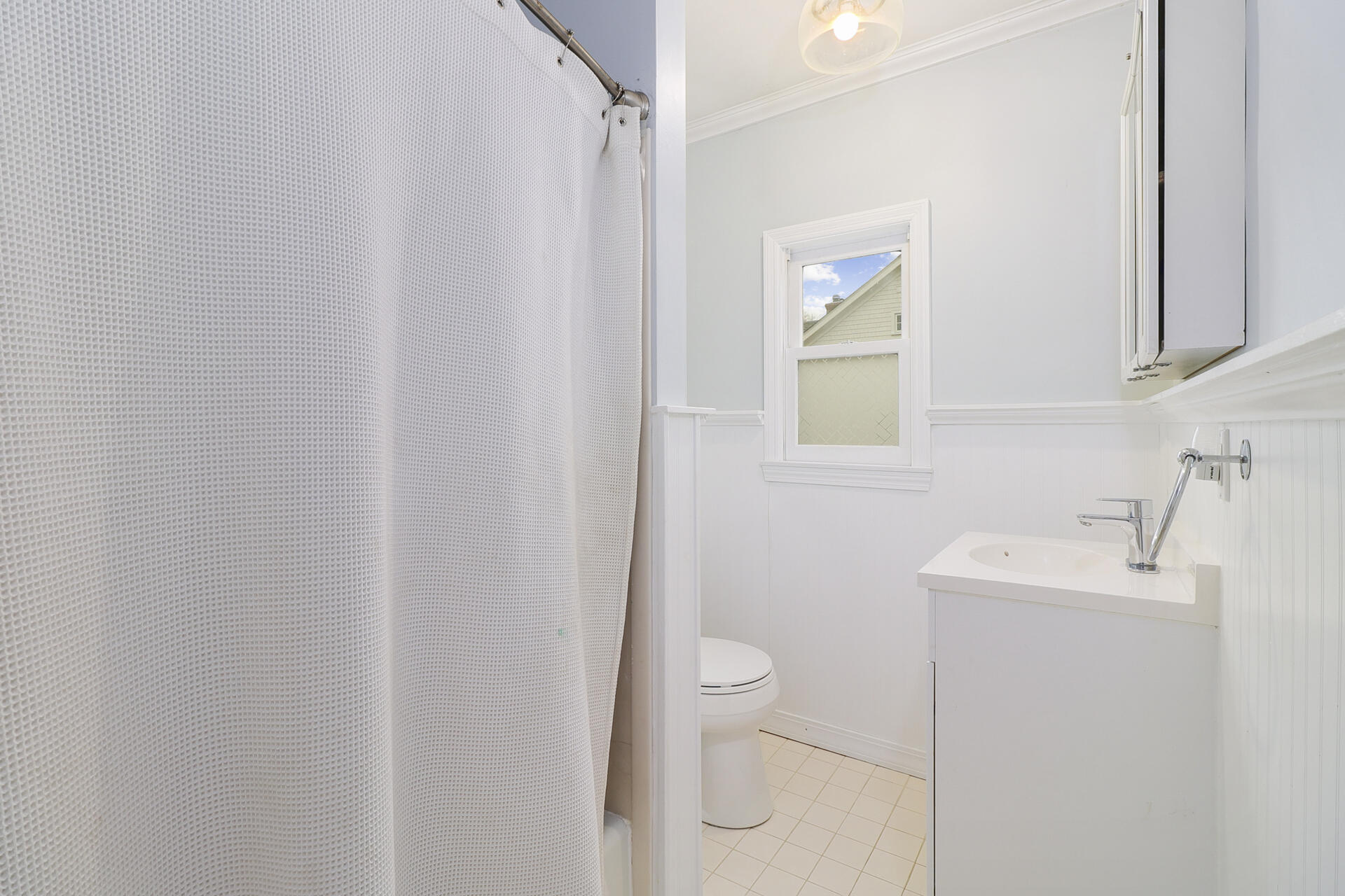 22 Birch Road Darien, CT 06820 - Photo 28 of 40 a bathroom with a sink a toilet and mirror